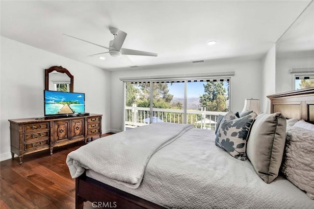 bedroom featuring dark wood-type flooring, ceiling fan, and access to outside