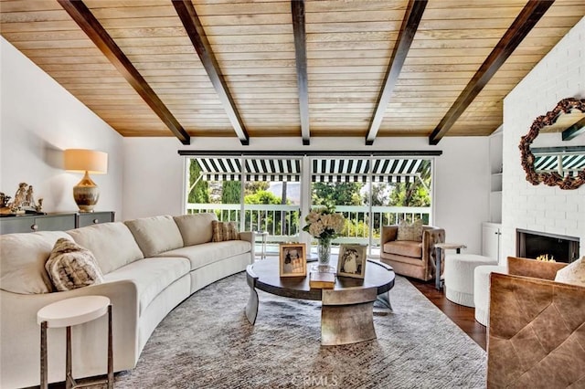 living room featuring dark wood-type flooring, a brick fireplace, wood ceiling, and lofted ceiling with beams