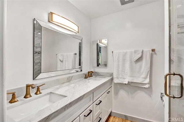 bathroom featuring hardwood / wood-style floors and vanity