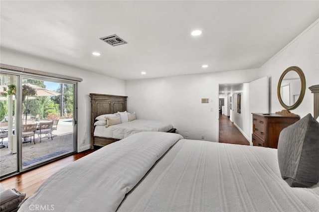 bedroom featuring dark hardwood / wood-style floors and access to outside