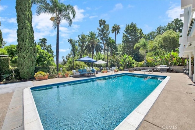 view of swimming pool featuring an outdoor hangout area and a patio area