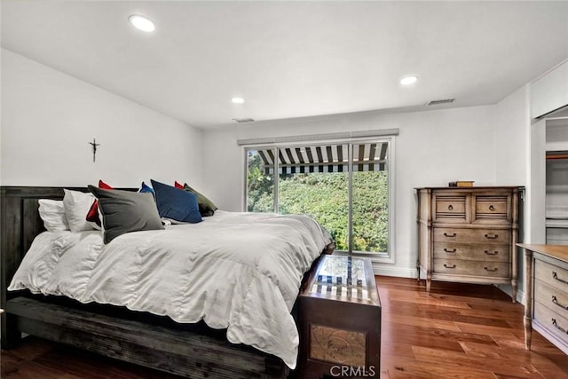 bedroom featuring dark hardwood / wood-style floors