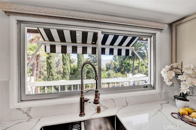 details with sink and light stone countertops