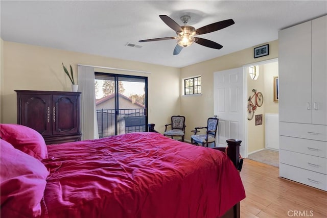 bedroom with ceiling fan, light hardwood / wood-style flooring, and access to outside