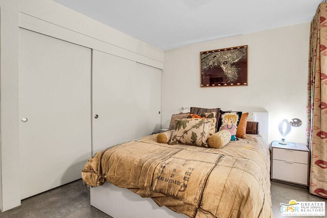 carpeted bedroom with a closet