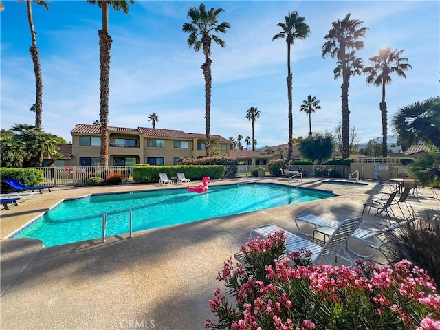 view of swimming pool featuring a patio area