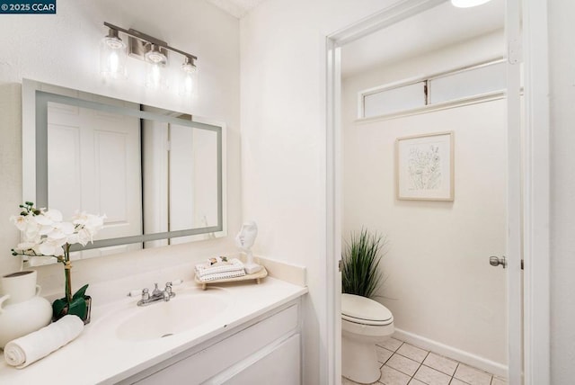 bathroom featuring tile patterned floors, vanity, and toilet