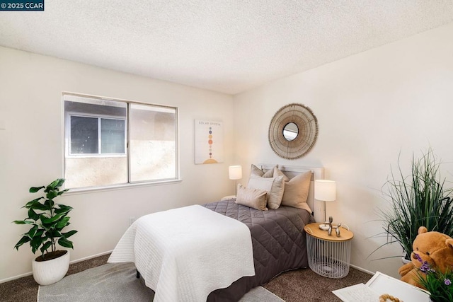 carpeted bedroom with a textured ceiling