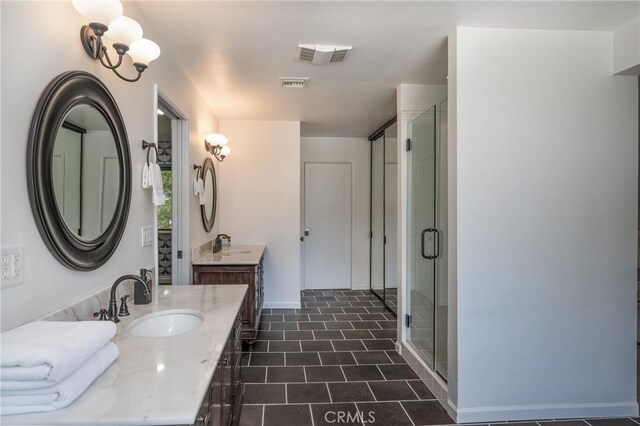 bathroom with walk in shower and vanity