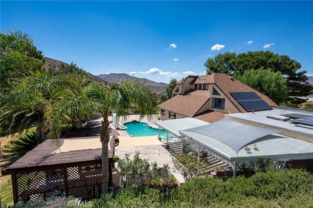 view of swimming pool featuring a mountain view