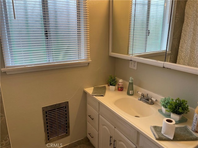 bathroom with visible vents and vanity