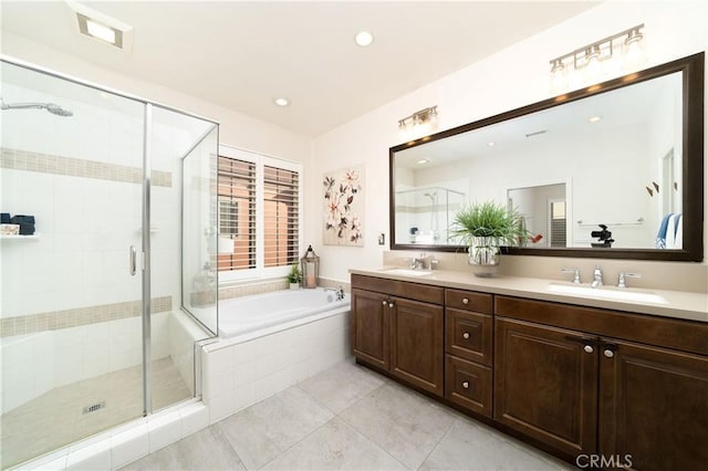 bathroom with vanity, separate shower and tub, and tile patterned flooring