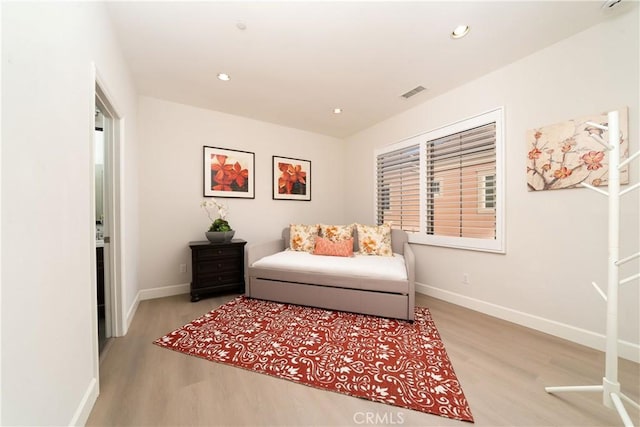 sitting room featuring light hardwood / wood-style flooring