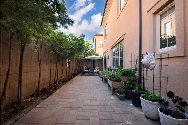 view of side of property featuring a patio