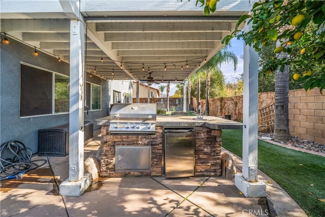 view of patio / terrace featuring an outdoor kitchen and area for grilling