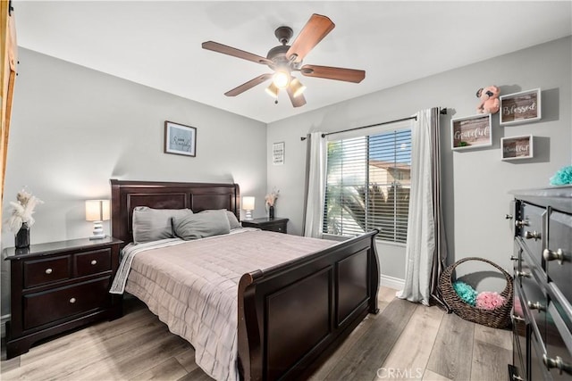 bedroom featuring ceiling fan and light hardwood / wood-style floors