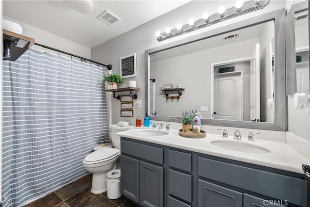 bathroom with toilet, a shower with curtain, and vanity