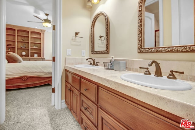 bathroom with ceiling fan and vanity