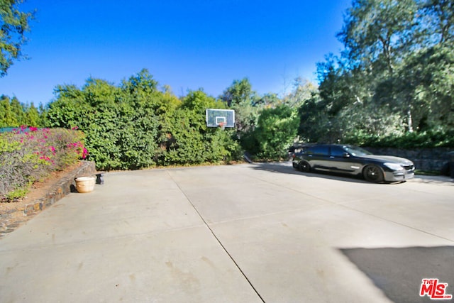 view of patio / terrace featuring basketball hoop