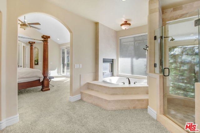 bathroom with ceiling fan and shower with separate bathtub