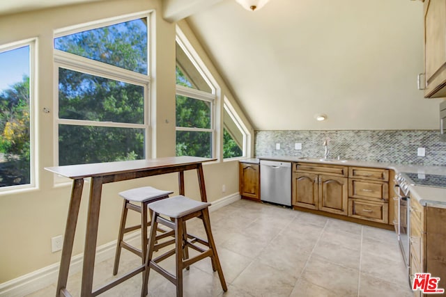 kitchen featuring vaulted ceiling with beams, decorative backsplash, sink, and stainless steel appliances