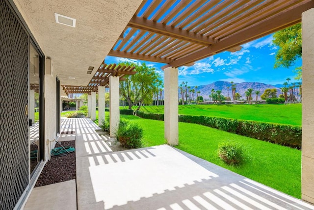 view of patio / terrace featuring a mountain view and a pergola