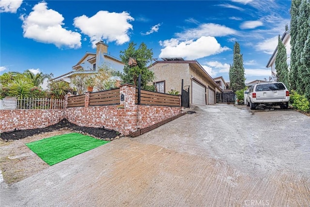 view of side of home featuring a garage