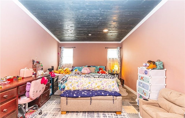 bedroom with multiple windows, ornamental molding, and hardwood / wood-style flooring