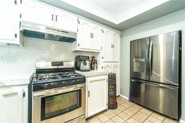 kitchen featuring white cabinetry, tasteful backsplash, light tile patterned flooring, and appliances with stainless steel finishes