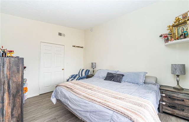 bedroom featuring hardwood / wood-style flooring