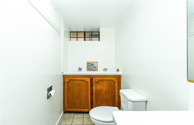 bathroom with tile patterned flooring and toilet