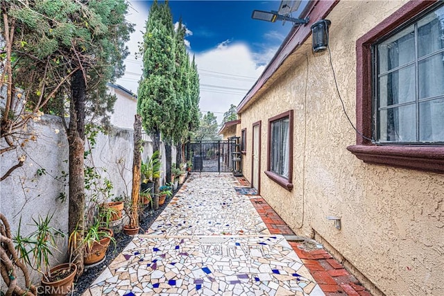 view of side of property featuring a patio area