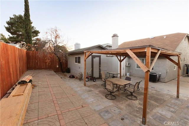 view of patio / terrace featuring cooling unit and a wall mounted AC