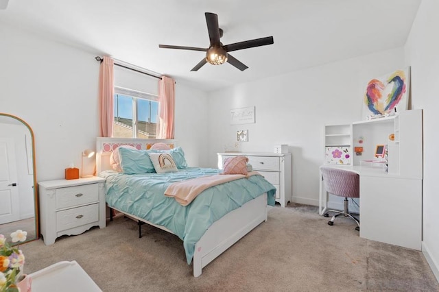 bedroom with light carpet and ceiling fan