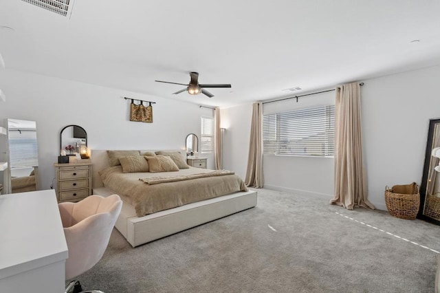 bedroom with ceiling fan and carpet floors