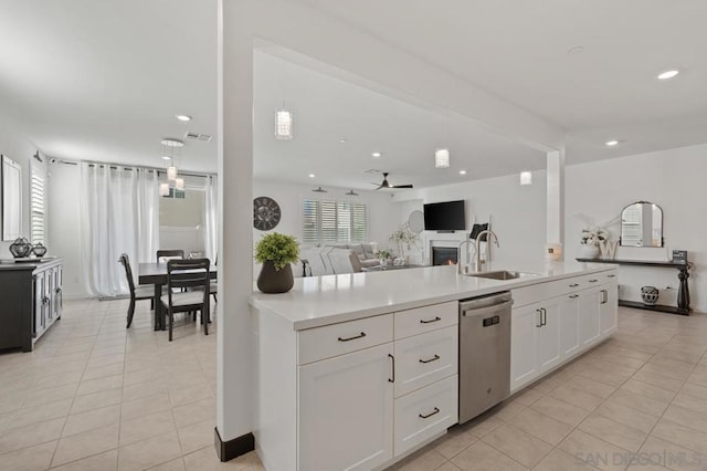 kitchen featuring pendant lighting, white cabinets, dishwasher, sink, and ceiling fan