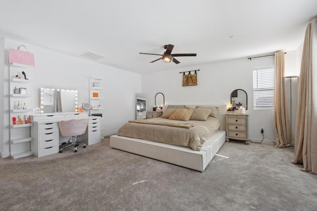 bedroom featuring ceiling fan and light colored carpet