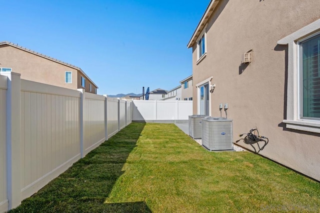 view of yard featuring central air condition unit