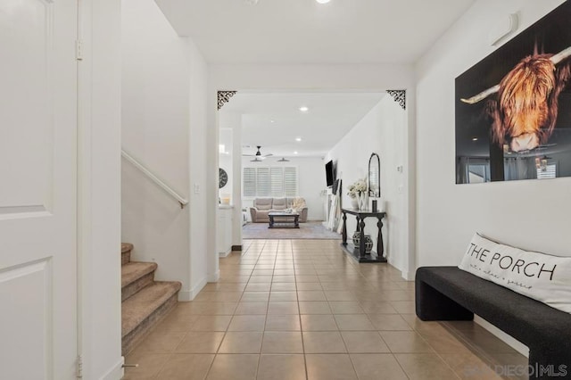 entrance foyer with ceiling fan and light tile patterned floors