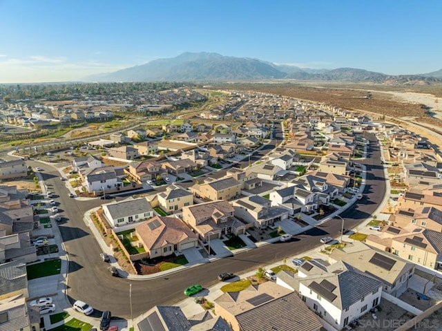 birds eye view of property with a mountain view