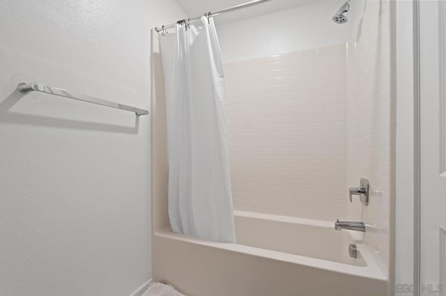 bathroom featuring shower / bath combination with curtain