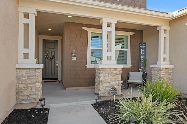 property entrance with covered porch