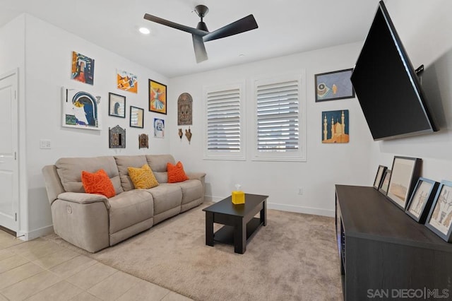 tiled living room featuring ceiling fan