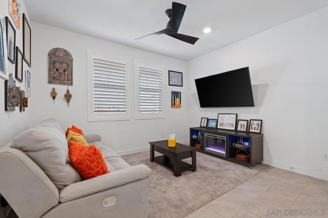 living room with ceiling fan and light tile patterned floors