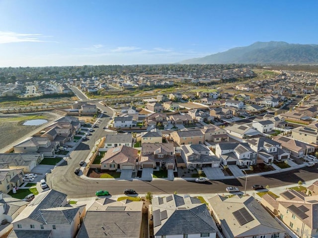 drone / aerial view featuring a mountain view