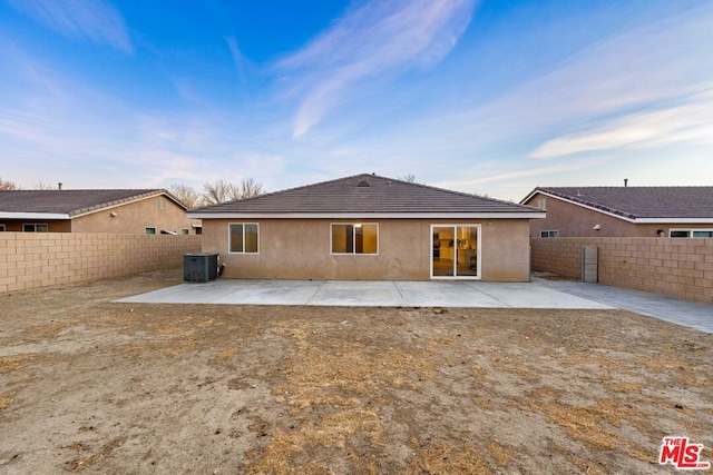 back of house featuring a patio and central AC