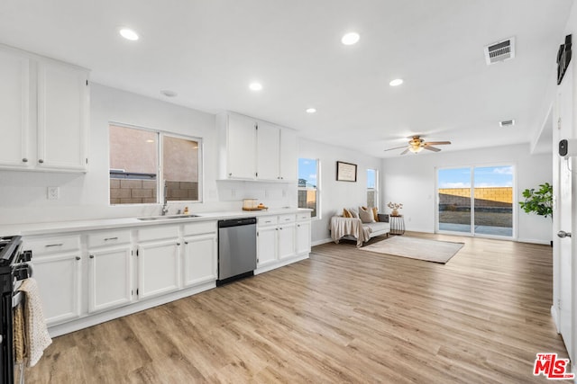 kitchen featuring ceiling fan, white cabinets, and stainless steel appliances