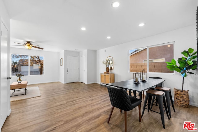 dining area featuring ceiling fan and light hardwood / wood-style floors