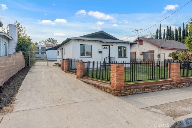 bungalow-style house with a front yard