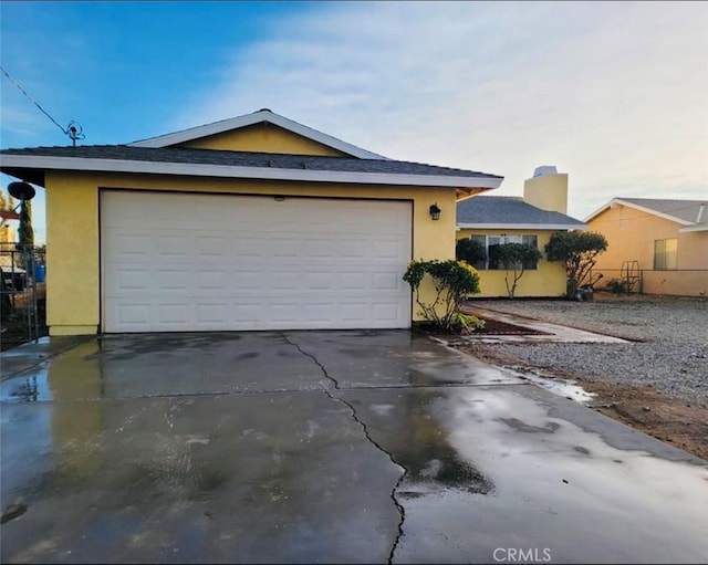 10907 Bartlett, Adelanto, CA 92301 - single story home with stucco siding, driveway, and a garage